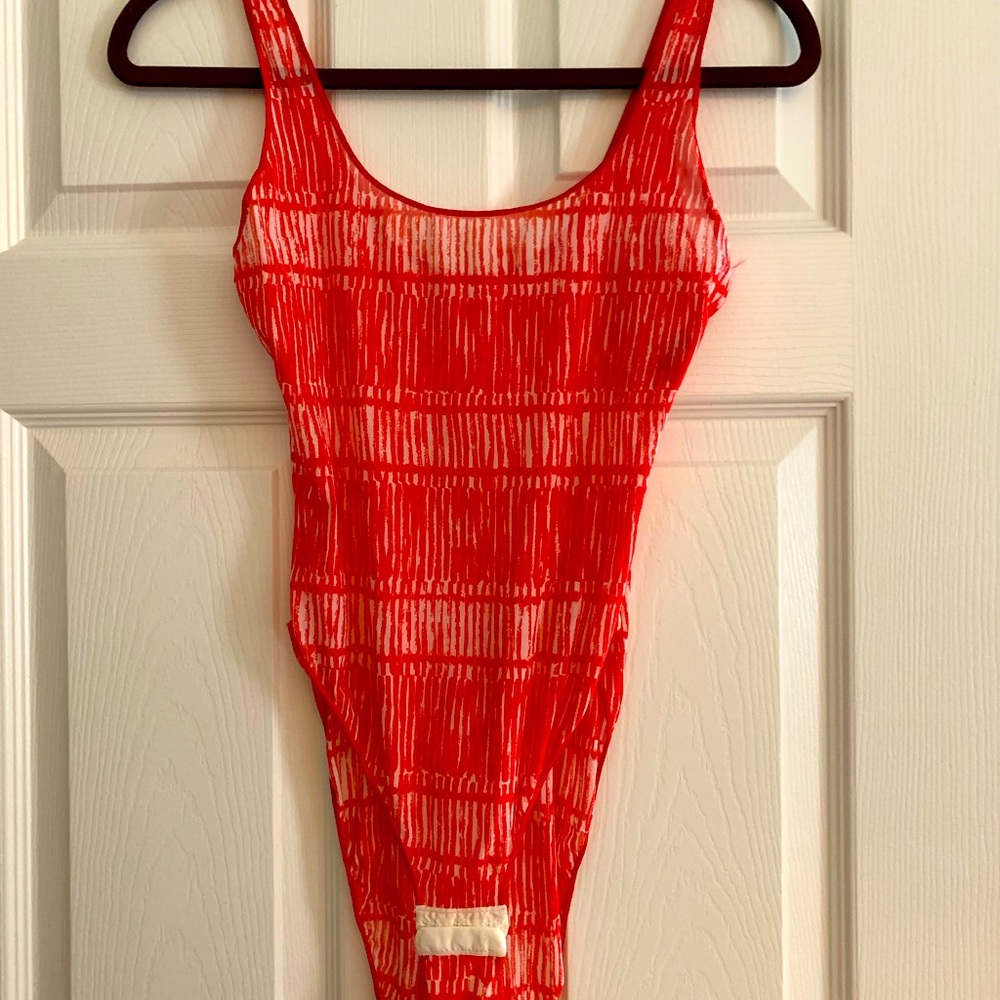 Red & white sheer Armani bodysuit.